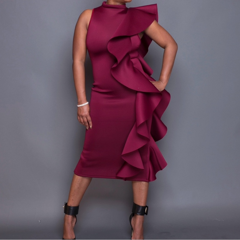 Beautiful burgundy dress with lovely detail along the left side of dress.